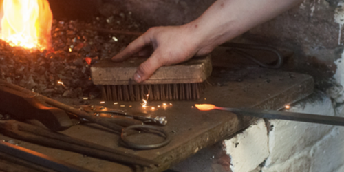 Forge making a horse shoe